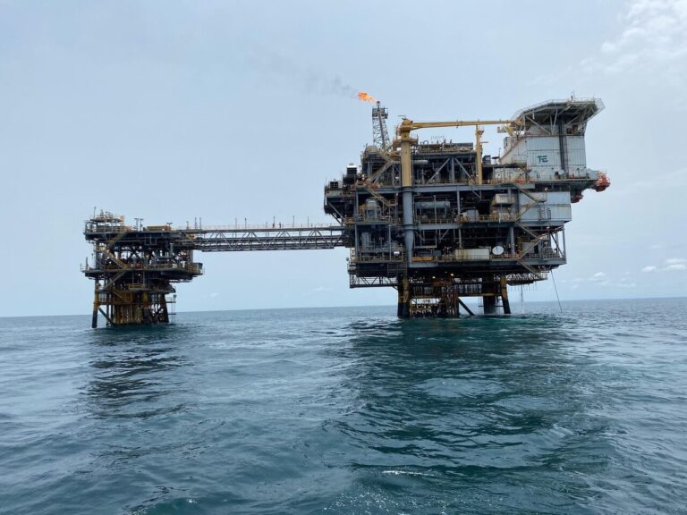 Offshore production platform and bridge-linked wellhead platform with flare