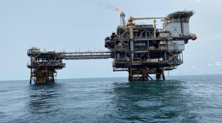 Offshore production platform and bridge-linked wellhead platform with flare