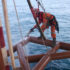 IRATA rope access technician performing hydro-blasting on an offshore platform structure
